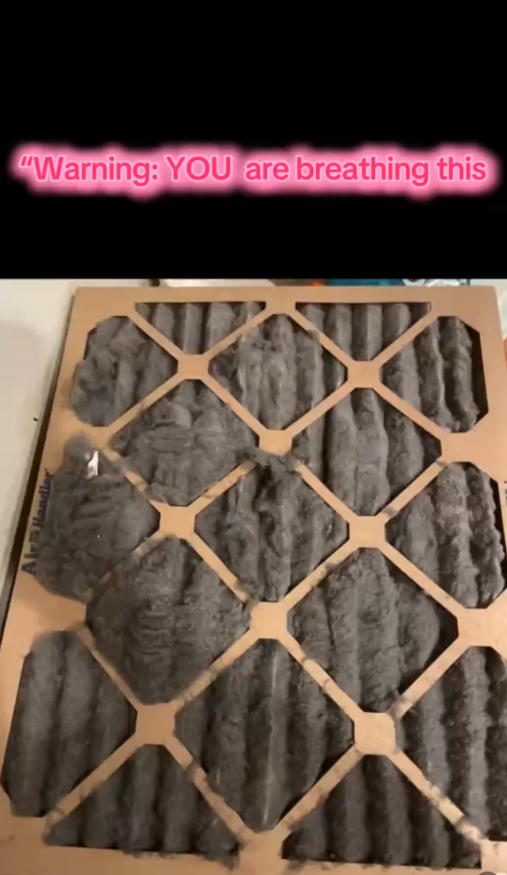 Dirty HVAC air filter showing heavy dust buildup